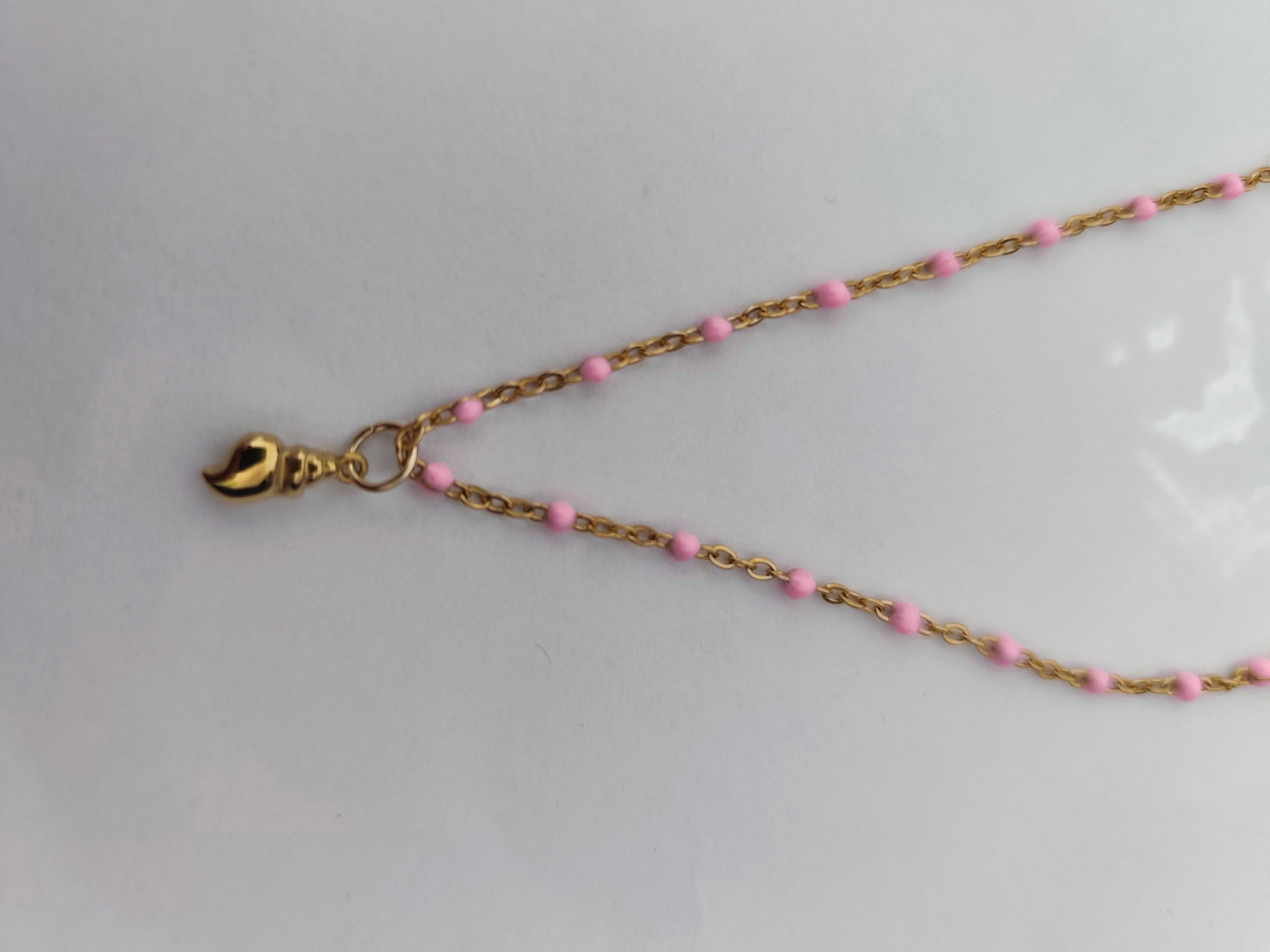 Colar em Aço Dourado Búzio